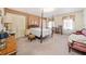 Large main bedroom with carpeting, a four-poster bed and built-in shelving at 1765 Holly Springs Ne Rd, Marietta, GA 30062