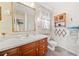 Clean bathroom with a vanity, toilet, and shower/tub combo at 1765 Holly Springs Ne Rd, Marietta, GA 30062