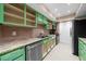 Modern kitchen with stainless steel appliances and green cabinets at 6851 Roswell Rd # O11, Atlanta, GA 30328