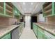 Renovated kitchen, featuring green cabinets and granite countertops at 6851 Roswell Rd # O11, Atlanta, GA 30328