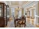 Bright dining room with hardwood floors, large windows, and a lovely chandelier at 4385 Hamilton Mill Rd, Buford, GA 30518