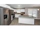 Modern kitchen with stainless steel appliances and granite countertops at 214 Kensington Trce, Stockbridge, GA 30281