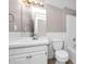 Clean bathroom with white vanity and tile flooring at 214 Kensington Trce, Stockbridge, GA 30281