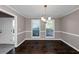 Bright dining room with hardwood floors and a chandelier at 214 Kensington Trce, Stockbridge, GA 30281