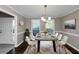 Modern dining room with concrete table and white chairs at 214 Kensington Trce, Stockbridge, GA 30281