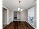 Dining room features hardwood floors and neutral wall colors at 214 Kensington Trce, Stockbridge, GA 30281