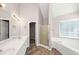 Bathroom boasts double sinks, soaking tub, and walk-in shower at 214 Kensington Trce, Stockbridge, GA 30281