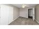 Bright bedroom with ceiling fan and double closets at 214 Kensington Trce, Stockbridge, GA 30281