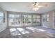 Bright sunroom with multiple windows and a ceiling fan at 2864 Holly Oaks Dr, Marietta, GA 30062