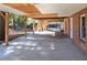 Covered patio, concrete floor, brick house, backyard access at 2864 Holly Oaks Dr, Marietta, GA 30062