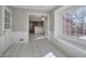 Bright breakfast room features tile flooring and view into kitchen at 2864 Holly Oaks Dr, Marietta, GA 30062