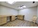 Simple basement kitchenette with wood cabinets and chair at 2864 Holly Oaks Dr, Marietta, GA 30062
