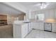 White kitchen with island, stainless steel appliances, and tile floor at 2864 Holly Oaks Dr, Marietta, GA 30062