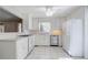 Kitchen boasts white cabinets, stainless steel appliances, and tile floors at 2864 Holly Oaks Dr, Marietta, GA 30062