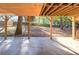 Covered back patio with concrete flooring and backyard view at 2864 Holly Oaks Dr, Marietta, GA 30062