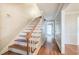 Bright entryway with hardwood floors and a wooden staircase at 2864 Holly Oaks Dr, Marietta, GA 30062