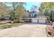 Two-story house with three-car garage and porch at 2864 Holly Oaks Dr, Marietta, GA 30062