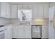 White kitchen cabinets, stainless steel dishwasher and view of window at 2864 Holly Oaks Dr, Marietta, GA 30062