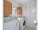Bright laundry room with window, cabinets and washer/dryer at 2864 Holly Oaks Dr, Marietta, GA 30062