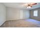 Spacious bedroom with ceiling fan and neutral carpeting at 2864 Holly Oaks Dr, Marietta, GA 30062