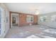 Sunroom featuring brick wall, carpet flooring, and access to other rooms at 2864 Holly Oaks Dr, Marietta, GA 30062