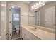 Updated bathroom with single vanity and built-in mirror at 2864 Holly Oaks Dr, Marietta, GA 30062