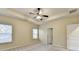 Large bedroom with ceiling fan, window, and door to en-suite bathroom at 3419 Woodward Down Trl, Buford, GA 30519