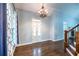 Bright entryway with hardwood floors, chandelier, and double doors at 1391 Arbor Hill Ct, Lawrenceville, GA 30045