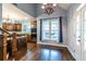 Kitchen features dark wood cabinets, granite counters, and stainless steel appliances at 1391 Arbor Hill Ct, Lawrenceville, GA 30045