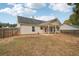 House with covered patio and fenced backyard at 102 Rocky Branch Way, Villa Rica, GA 30180