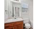 Bathroom with wood vanity, toilet, and bathtub at 102 Rocky Branch Way, Villa Rica, GA 30180