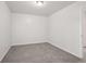 Simple bedroom with gray carpet and a window, ready for personalization at 102 Rocky Branch Way, Villa Rica, GA 30180