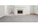 Spacious living room with grey carpet, fireplace, and neutral walls at 102 Rocky Branch Way, Villa Rica, GA 30180