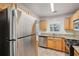 Stainless steel refrigerator in kitchen with granite counters at 102 Rocky Branch Way, Villa Rica, GA 30180
