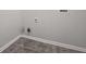 Simple laundry room with gray floor and white walls at 102 Rocky Branch Way, Villa Rica, GA 30180