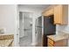 Kitchen with stainless steel refrigerator and granite countertops at 102 Rocky Branch Way, Villa Rica, GA 30180