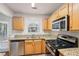 Kitchen features granite countertops and stainless steel appliances at 102 Rocky Branch Way, Villa Rica, GA 30180