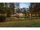 Brick home with lights, gated entrance, and landscaping at 5211 Hadaway Nw Rd, Kennesaw, GA 30152