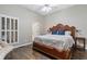 Spacious main bedroom with a large bed and hardwood floors at 5211 Hadaway Nw Rd, Kennesaw, GA 30152