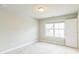 Simple bedroom with carpet and large window at 4204 Hardy Ave, Smyrna, GA 30082