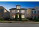 Attractive three-story home with lighted windows at dusk at 4204 Hardy Ave, Smyrna, GA 30082