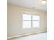 Simple bedroom with carpeted floor and large window at 4204 Hardy Ave, Smyrna, GA 30082