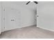 Bright bedroom featuring double doors and wall-to-wall carpet at 468 Latta Ne St, Atlanta, GA 30308