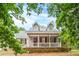 Two story house with front porch and stone base at 160 Cross Rd, Covington, GA 30016