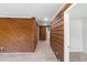 Bright hallway with wood-paneled walls and vinyl flooring at 389 Oglesby Bridge Se Rd, Conyers, GA 30094