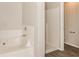 Bathroom with separate shower and soaking tub at 611 Shadow Valley Ct, Lithonia, GA 30058