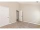 Spacious bedroom with carpet, neutral walls, and white doors at 611 Shadow Valley Ct, Lithonia, GA 30058