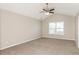 Spacious bedroom with vaulted ceiling, carpet, and large window at 611 Shadow Valley Ct, Lithonia, GA 30058