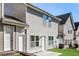Backyard view of a two-story home in a residential community at 611 Shadow Valley Ct, Lithonia, GA 30058