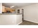 Eat-in kitchen with granite countertops, wood cabinetry, and stainless steel appliances at 611 Shadow Valley Ct, Lithonia, GA 30058